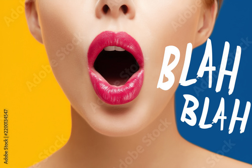 Woman mouth close up on vivid background with BLAH BLAH text