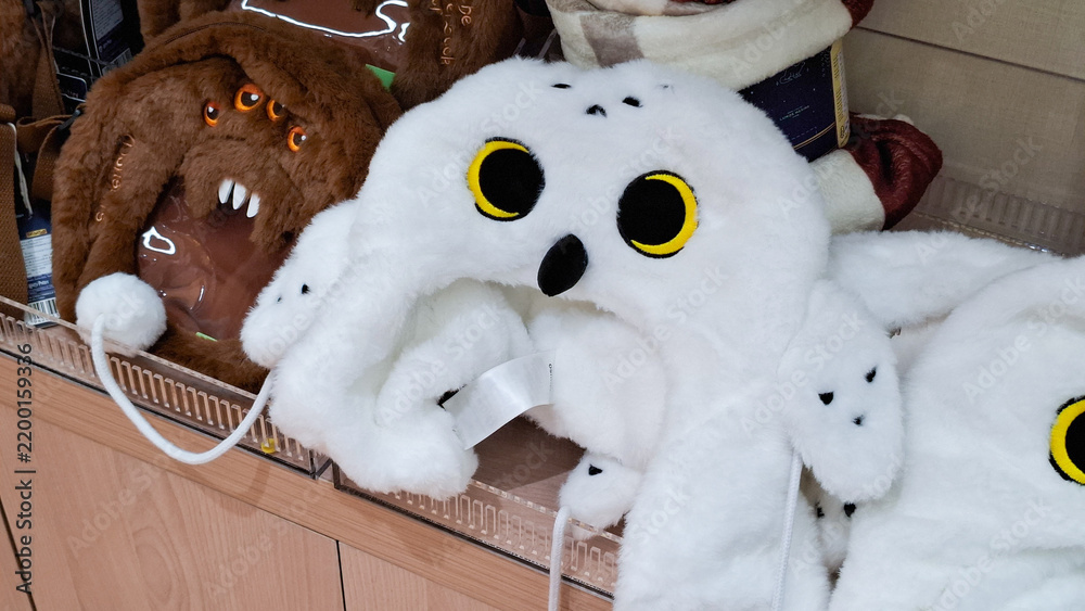 Fototapeta premium Harry Potter Hedwig Miniso snowy owl fluffy winter hat merchandise displayed on retail store shelf on September 16, 2026 in Bangkok, Thailand 
