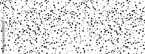 Small polka dots create a charming seamless pattern with irregular black spots on white background. Perfect for baby textiles, cute prints, and modern designs with small organic touches.