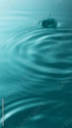 Water Ripples in Tranquil Teal Scene Forming Gentle Circles