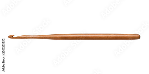 Single wooden crochet hook with a smooth, light brown finish is horizontally positioned on a clean white background