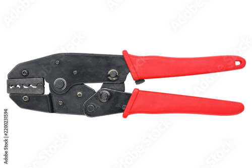 Bild auf Leinwand Black and red crimping tool with textured handles is precisely positioned agains