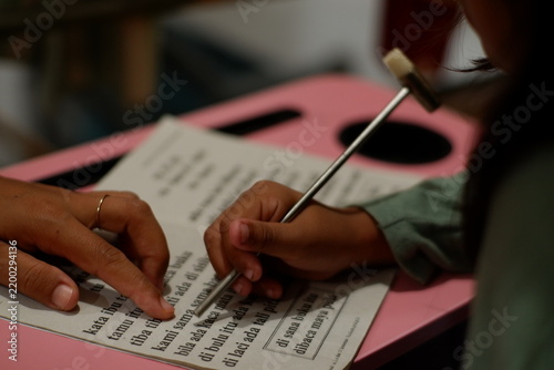 Close Up of Mother Teaching Her Daughter Studying