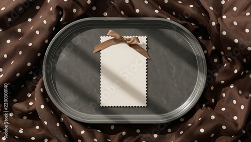Card on a Brown Tray With Polka Dot Fabric Under Natural Light