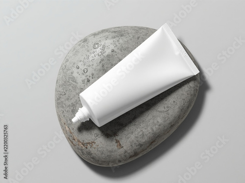 White cosmetic squeeze tube mockup on stone