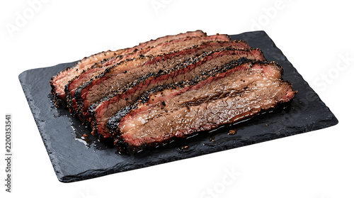 Thinly sliced smoked beef brisket on a black slate serving board with barbecue meat bbq brisket cooked beef meat slices beef cuts protein food main dish