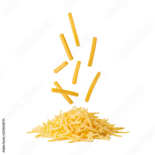 flaky yellow shredded cheese falling from above on white background