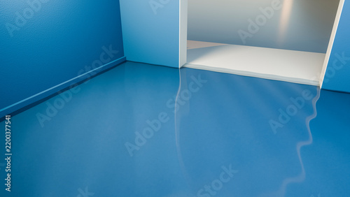 Blue shiny floor with white threshold in modern minimalist interior