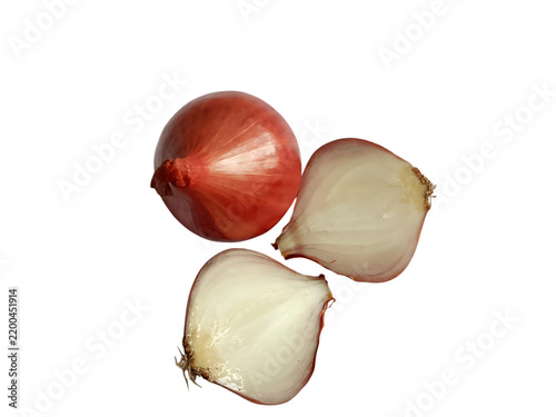 Fresh red onion whole and cut in half on a black background studio lighting