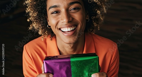 Smiling Woman Holding Purple and Green Gift, Celebration Joy