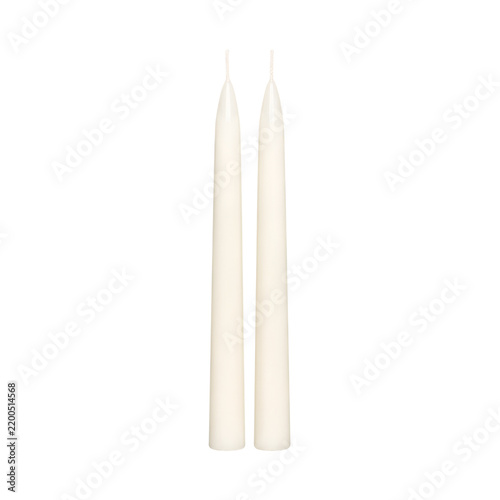 Pair of elegant white taper dinner candles isolated on white background