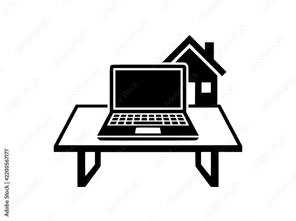 Fototapeta premium Laptop computer on a desk workspace with a small house icon nearby