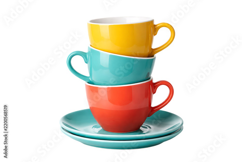 Stack of colorful ceramic coffee cups on saucers isolated on a transparent background