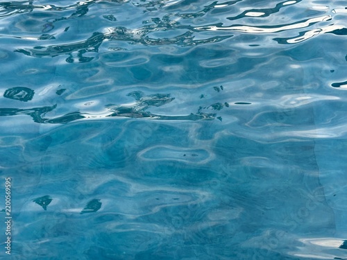 Blue water in the swimming pool close up