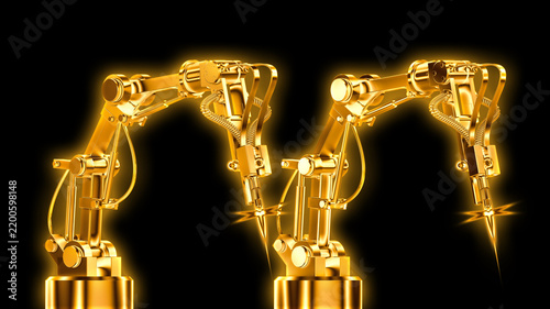 zwei Schweißroboter goldfarben