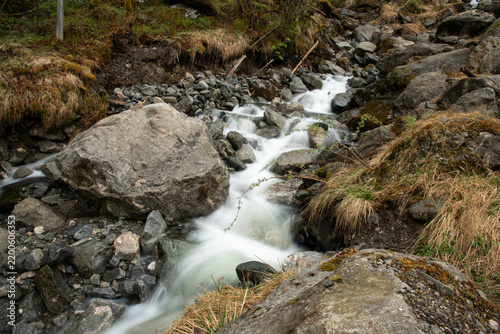 Rocky stream flowing in mountain landscape