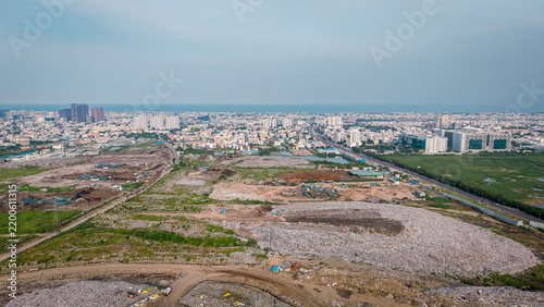 Obraz na plátně Large garbage landfill dump beside the OMR city development in Chennai aerial wa