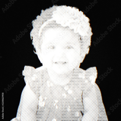 Portrait of a young baby girl wearing a floral headband isolated on white