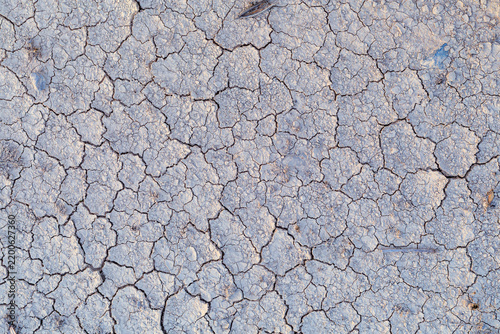 Konstfotografi Dry cracked earth forms a dense mosaic of polygon shaped clay segments across an arid landscape shaped by prolonged drought