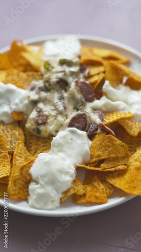 Loaded nachos with melted mozzarella cheese and tender beef close-up
