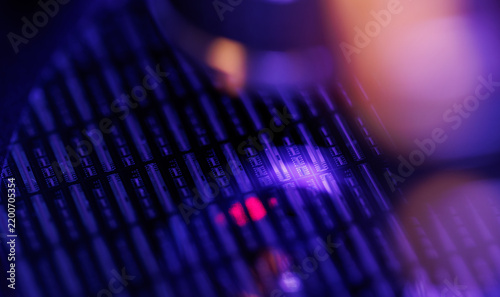 Closeup silicon microchip wafer with purple neon bokeh lighting for technology background and cyberpunk synthwave electronics