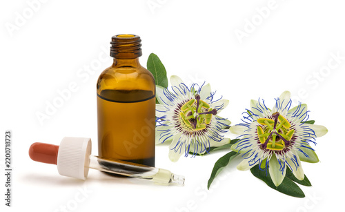 Passionflower Branch with flowers and Herbal Extract Dropper and Bottle Isolated on White Background