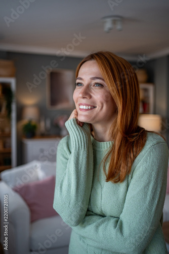 Фотография Woman smiling looking away feeling relaxed and happy