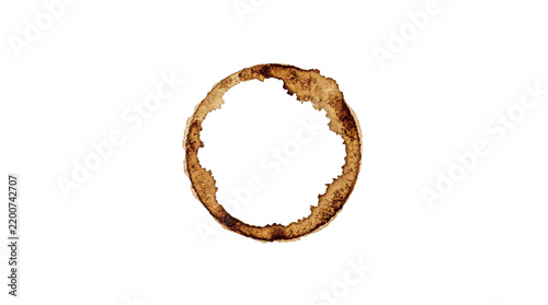 Fotografie A single dark brown coffee ring stain isolated on a clean white background for d
