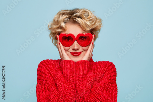 Woman Wearing Heart Sunglasses and Red Sweater