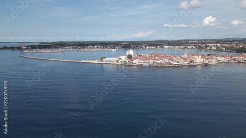 Aerial panorama of Umag old town peninsula breakwater and bay in Istria Croatia

