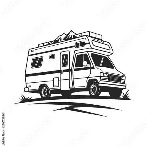 Retro RV Camper Van parked on grassy hill with mountain peak backdrop during daylight adventure