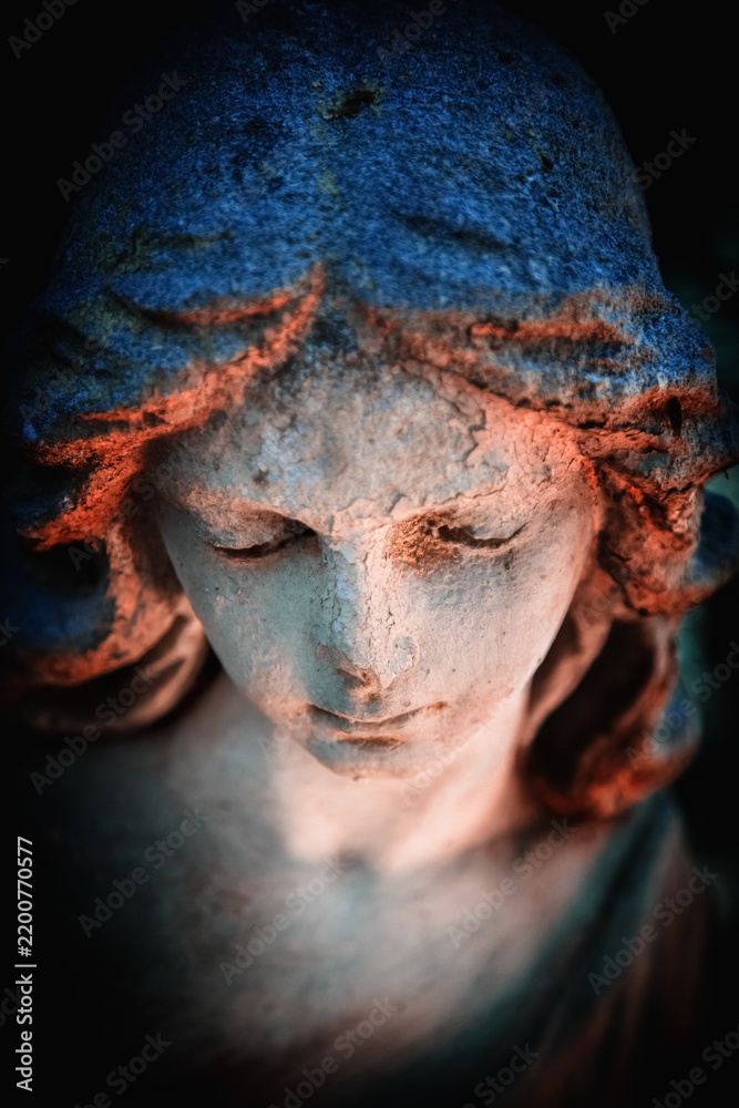 Obraz premium Serene angel with lowered eyes in deep prayer and contemplation, symbolizing humility, faith, inner peace, divine protection and spiritual reflection.