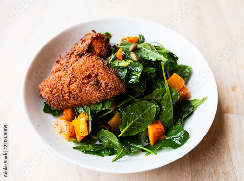 Healthy and flavorful fall salad with crispy gluten free chicken from a popular wine bar and restaurant.