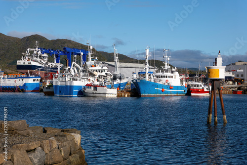 Fishing vessels and shipyard in Ballstad harbor on the Lofoten Islands, Norway