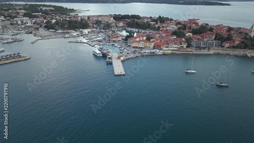 Aerial orbit view of harbor pier marina and historic town in Novigrad Istria Croatia