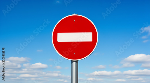 No Entry Traffic Sign Isolated Against Partly Cloudy Sky
