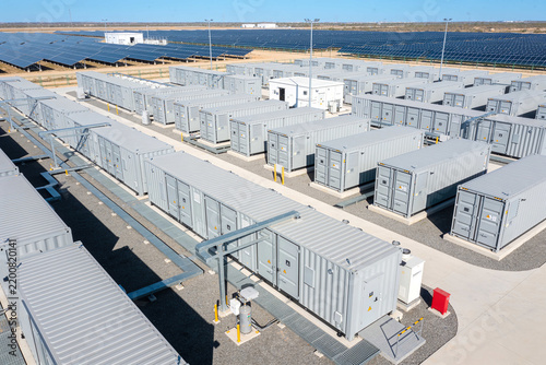 Renewable Energy & Sustainability – Aerial view of a large scale industrial battery energy storage system facility with rows of containers
