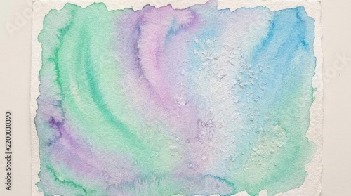 Pastel watercolor wash texture on rough paper background.