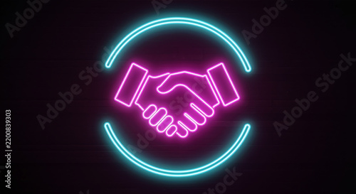 Neon handshake icon glowing in pink and blue light on dark background representing business partnership agreement and collaboration