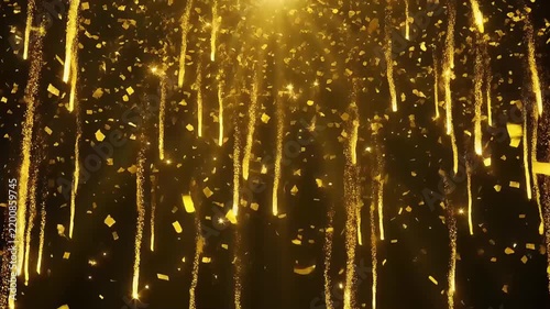Golden glitter confetti and sparkling light trails on black