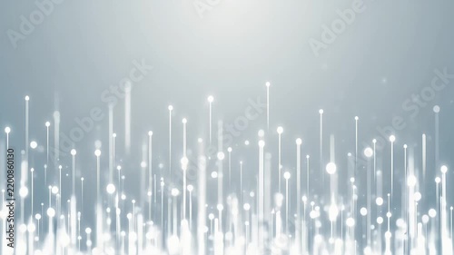 Glowing white light particles rising on soft blue background