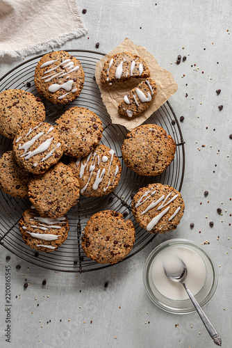 A top down view of a cooling rack topped with quinoa chocolate chip cookies.