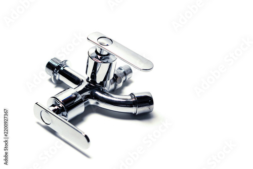 dual-control metallic chrome water tap isolated on a clean white background