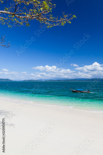 A pure tropical island on a sunny summer day.