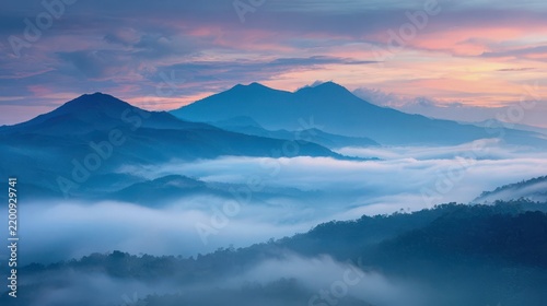Serene Mountain Landscape at Dawn with Mist and Soft Color Palette