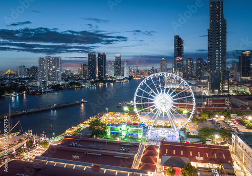 Aerial night view of the Ferris wheel at Asiatique The Riverfront on the Chao Phraya River, Bangkok, Thailand