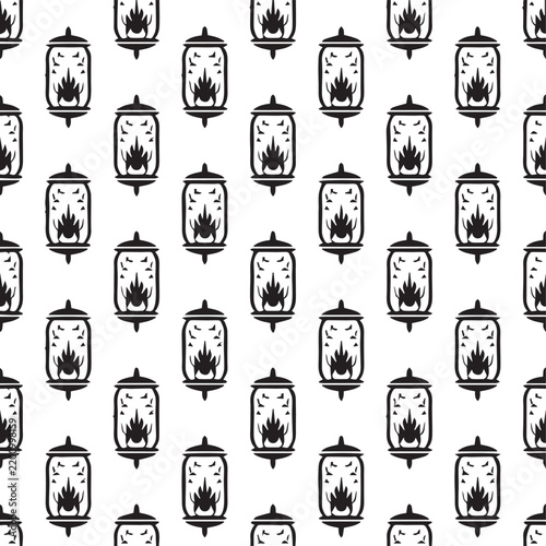 Seamless pattern of black silhouettes of vintage lanterns with burning flames and small bats flying inside, isolated on white background