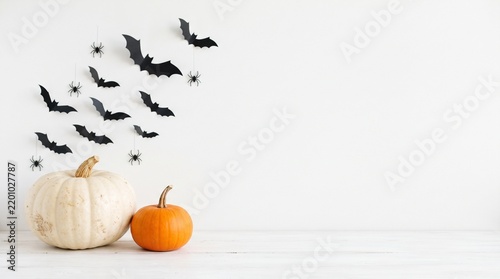 A group of small bats flying across a bright white sky during the day in a minimalist style