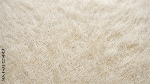 Abstract macro texture of white and peach colored faux fur fabric.