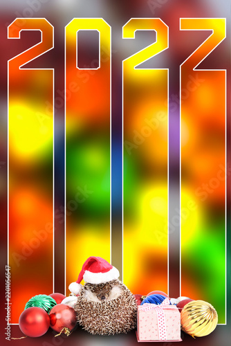Number 2027 with cute hedgehog wearing red santa hat with gift box and colorful ornaments balls.